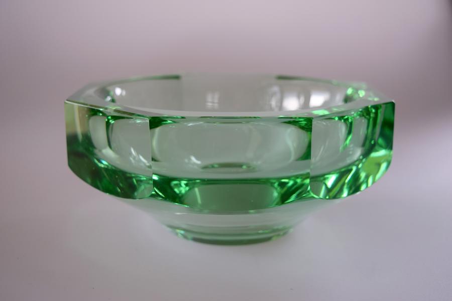 Thick green bowl by Daum .