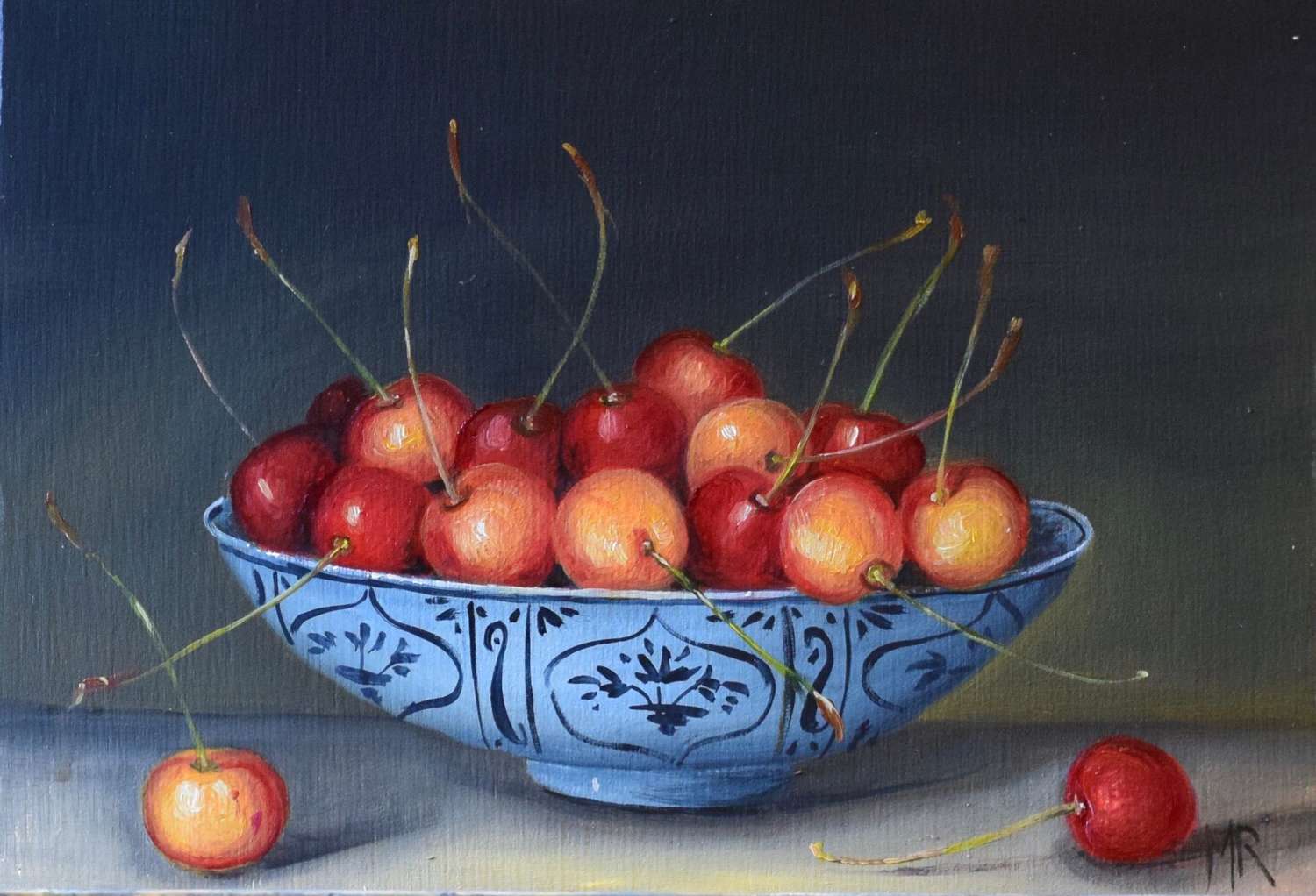 Red and yellow cherries in a bowl