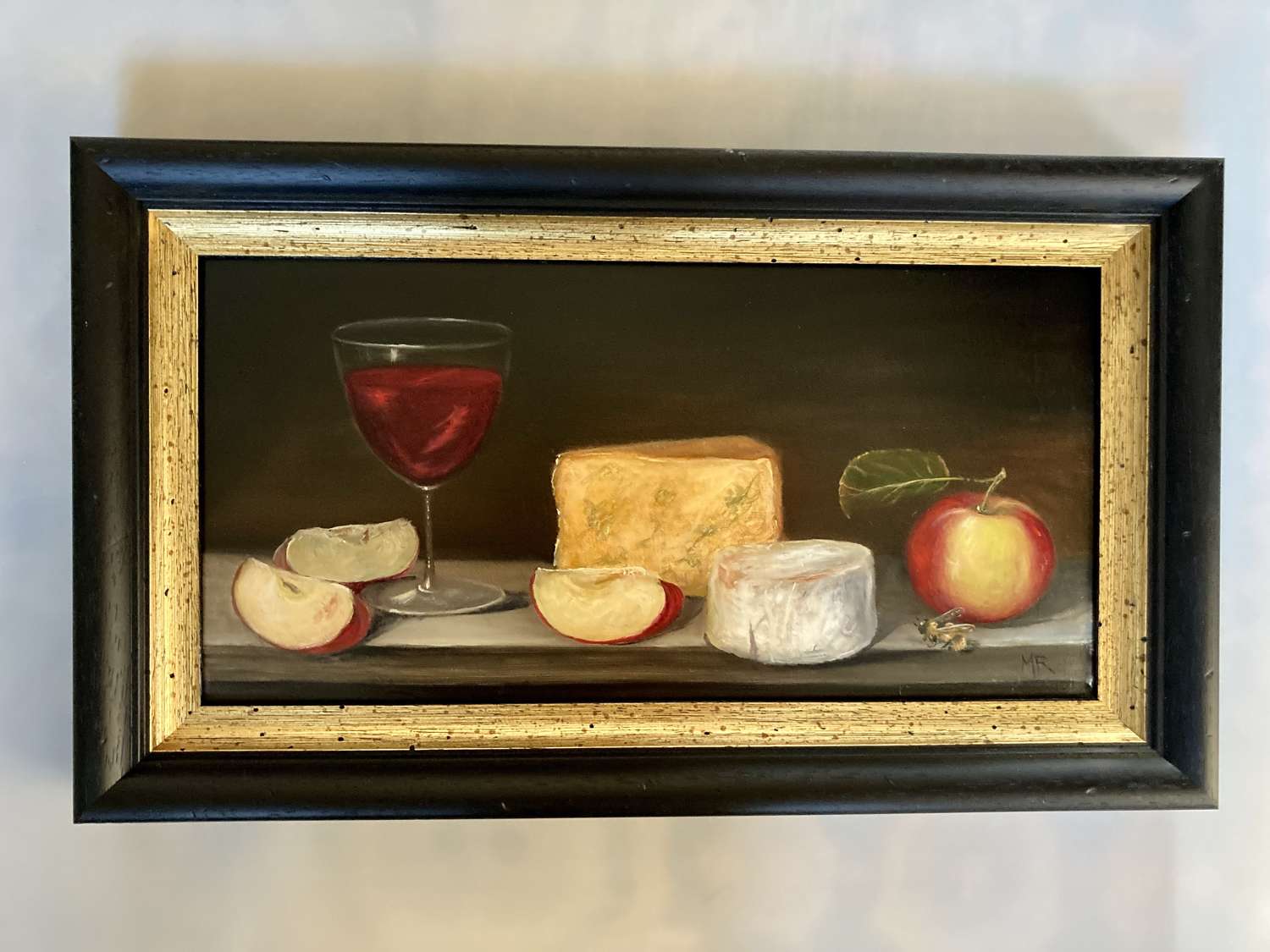 Cheese, wine, apples and a bee.