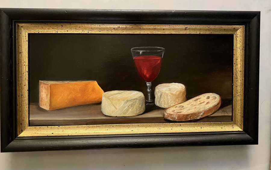 Still life with wine cheese and bread.
