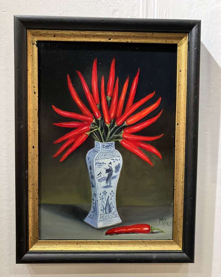 Vase of red chillis